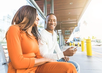 Couple waiting on a bus station