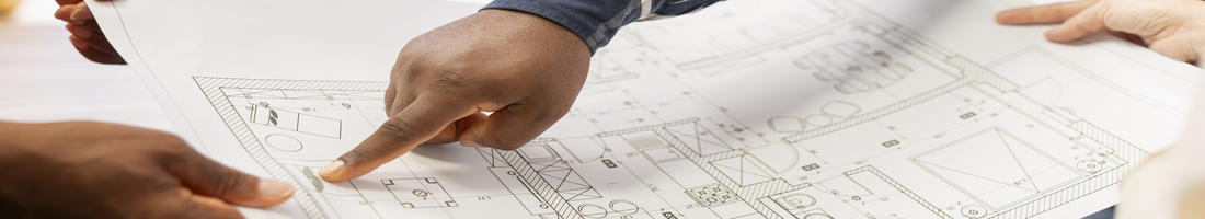 Business people examining blueprints and sketches with realtor during high class office space tour, discussing property layout. Negotiating contract for a modern workspace for relocation.