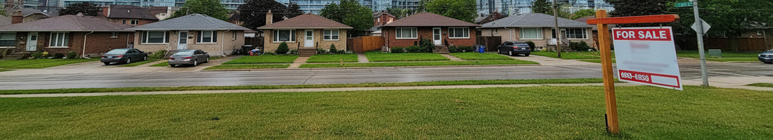 real estate property with a for sale sign